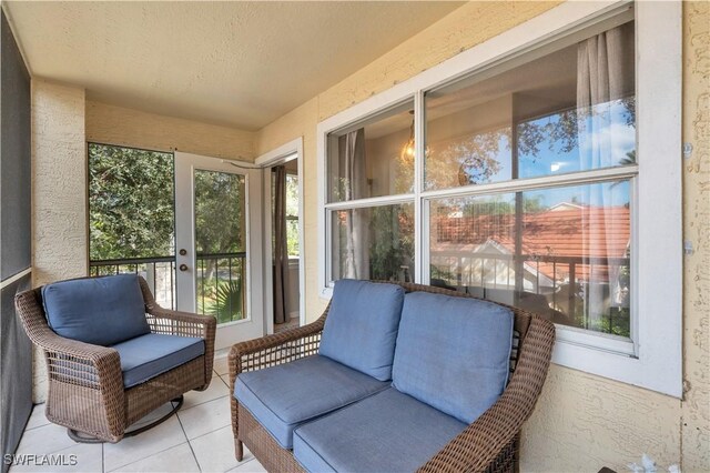 12520 Equestrian Cir Unit 310, Fort Myers, FL 33907 - sunroom / solarium with tile patterned floors and a textured wall