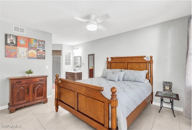 12520 Equestrian Cir Unit 310, Fort Myers, FL 33907 - bedroom featuring light tile patterned floors, baseboards, a textured ceiling, and a ceiling fan