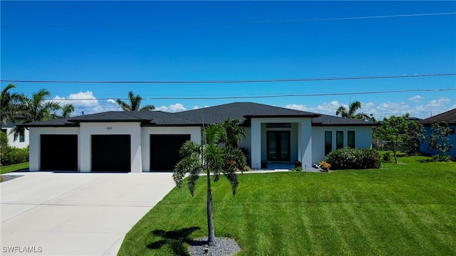 3621 NW 14th St, Cape Coral, FL 33993 - prairie-style home featuring an attached garage, concrete driveway, stucco siding, a front lawn, and roof with shingles