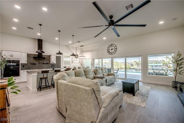 3621 NW 14th St, Cape Coral, FL 33993 - living room featuring a ceiling fan and recessed lighting