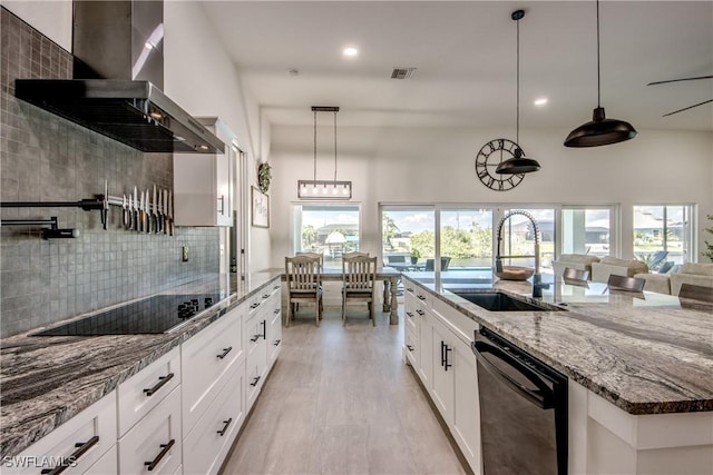 3621 NW 14th St, Cape Coral, FL 33993 - kitchen featuring wall chimney range hood, black appliances, a sink, tasteful backsplash, and recessed lighting
