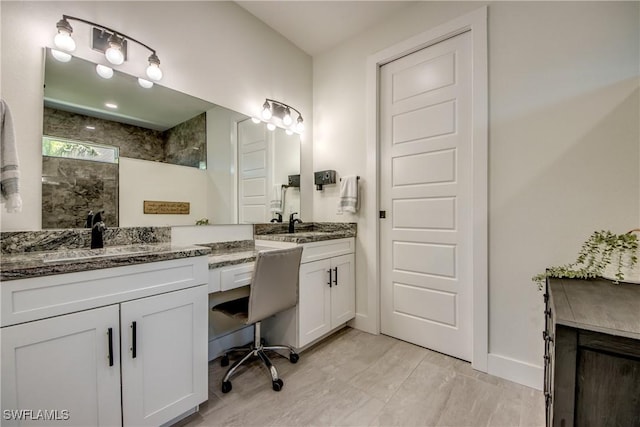 3621 NW 14th St, Cape Coral, FL 33993 - full bathroom with walk in shower, double vanity, and baseboards