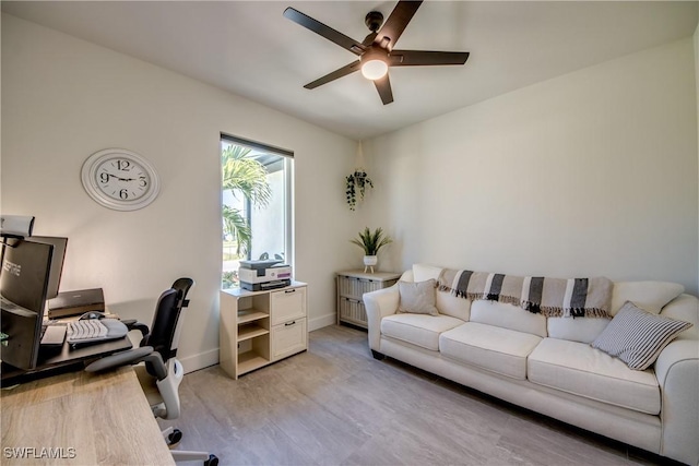 3621 NW 14th St, Cape Coral, FL 33993 - office featuring a ceiling fan, light wood-style floors, and baseboards
