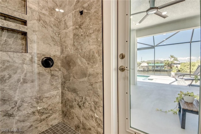 3621 NW 14th St, Cape Coral, FL 33993 - bathroom with a tile shower, a water view, and a ceiling fan
