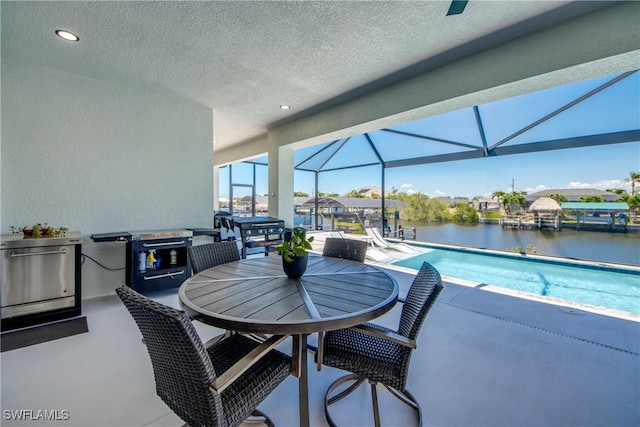 3621 NW 14th St, Cape Coral, FL 33993 - view of patio / terrace with an outdoor pool, glass enclosure, and a water view