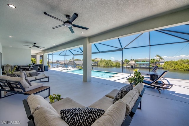 3621 NW 14th St, Cape Coral, FL 33993 - view of patio / terrace with an outdoor living space, ceiling fan, and a water view