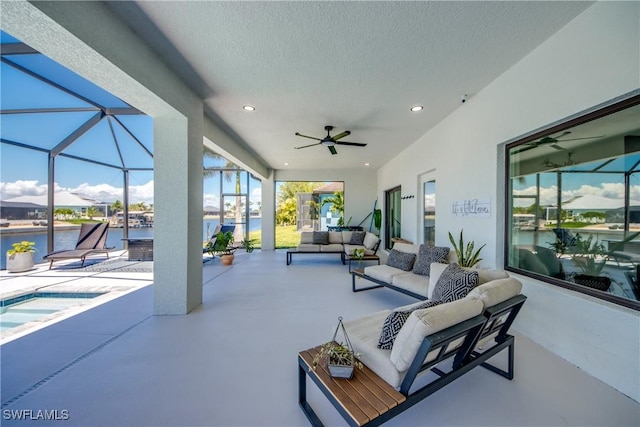 3621 NW 14th St, Cape Coral, FL 33993 - view of patio with outdoor lounge area, a hot tub, ceiling fan, a lanai, and a water view