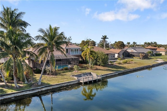 325 SE 21st St, Cape Coral, FL 33990 - dock with a water view, a lanai, a residential view, an outdoor pool, and a yard