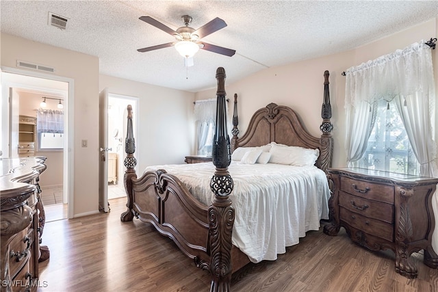 19703 Eagle Trace Ct, North Fort Myers, FL 33903 - bedroom featuring wood finished floors, multiple windows, ceiling fan, and a textured ceiling