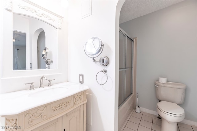 19703 Eagle Trace Ct, North Fort Myers, FL 33903 - bathroom with tile patterned flooring, vanity, and bath / shower combo with glass door