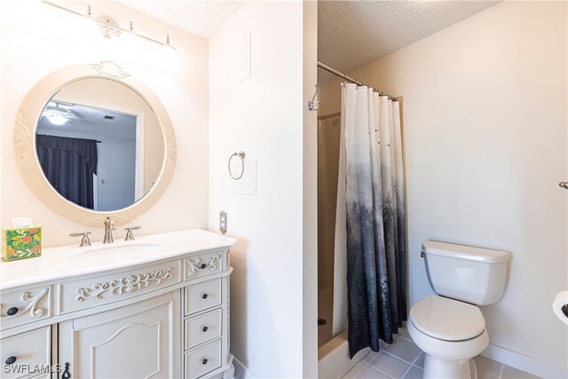 19703 Eagle Trace Ct, North Fort Myers, FL 33903 - full bathroom featuring vanity, a textured ceiling, a shower with shower curtain, and tile patterned flooring