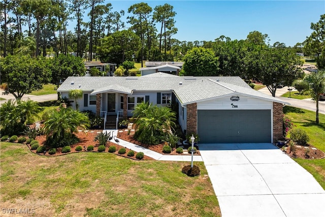 19703 Eagle Trace Ct, North Fort Myers, FL 33903 - ranch-style house featuring an attached garage, a front lawn, driveway, and brick siding