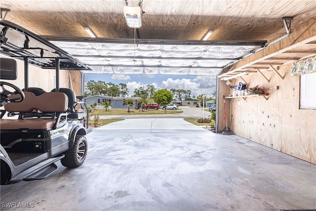 19703 Eagle Trace Ct, North Fort Myers, FL 33903 - garage featuring wooden walls