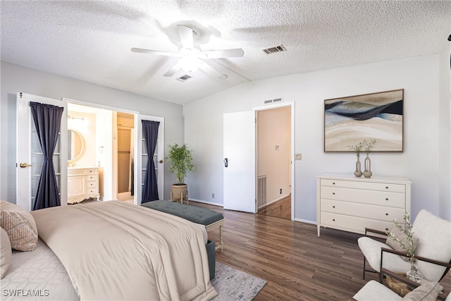 19703 Eagle Trace Ct, North Fort Myers, FL 33903 - bedroom with wood finished floors, lofted ceiling, a textured ceiling, a ceiling fan, and connected bathroom