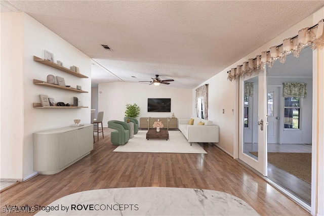 19703 Eagle Trace Ct, North Fort Myers, FL 33903 - living area with a textured ceiling, wood finished floors, and a ceiling fan