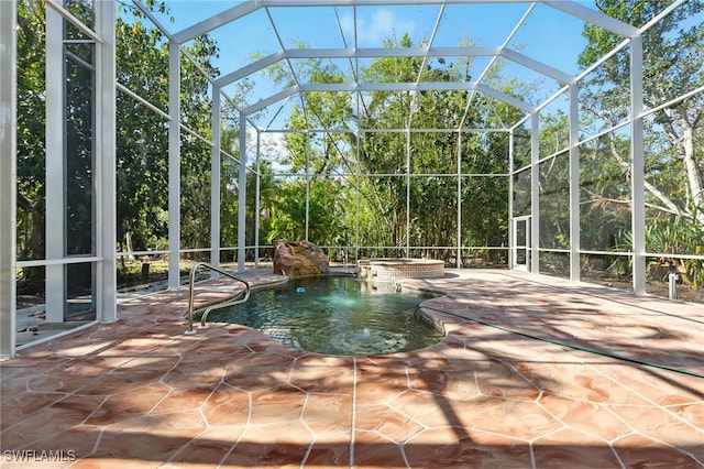 5697 Bay Point Rd, Bokeelia, FL 33922 - view of swimming pool featuring a patio, glass enclosure, and a pool with connected hot tub