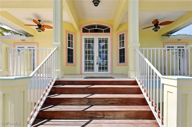 5697 Bay Point Rd, Bokeelia, FL 33922 - property entrance featuring ceiling fan, stucco siding, and french doors