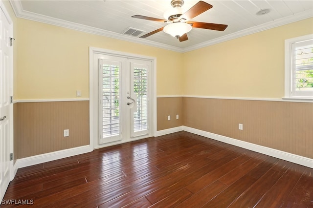 5697 Bay Point Rd, Bokeelia, FL 33922 - spare room with a wainscoted wall, hardwood / wood-style floors, ceiling fan, ornamental molding, and baseboards