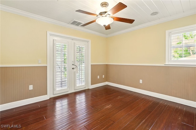 5697 Bay Point Rd, Bokeelia, FL 33922 - unfurnished room featuring wainscoting, wood-type flooring, a ceiling fan, baseboards, and ornamental molding