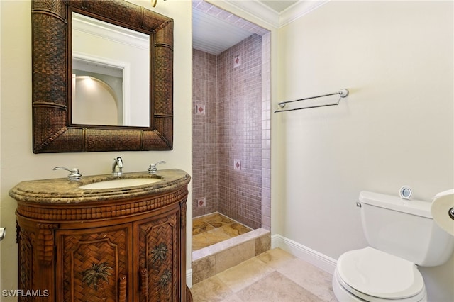 5697 Bay Point Rd, Bokeelia, FL 33922 - bathroom featuring toilet, crown molding, vanity, a shower stall, and baseboards
