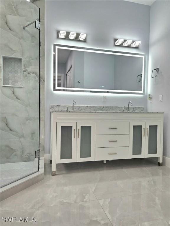 4391 66th Ave NE, Naples, FL 34120 - full bathroom featuring marble look tiles, a marble finish shower, and double vanity