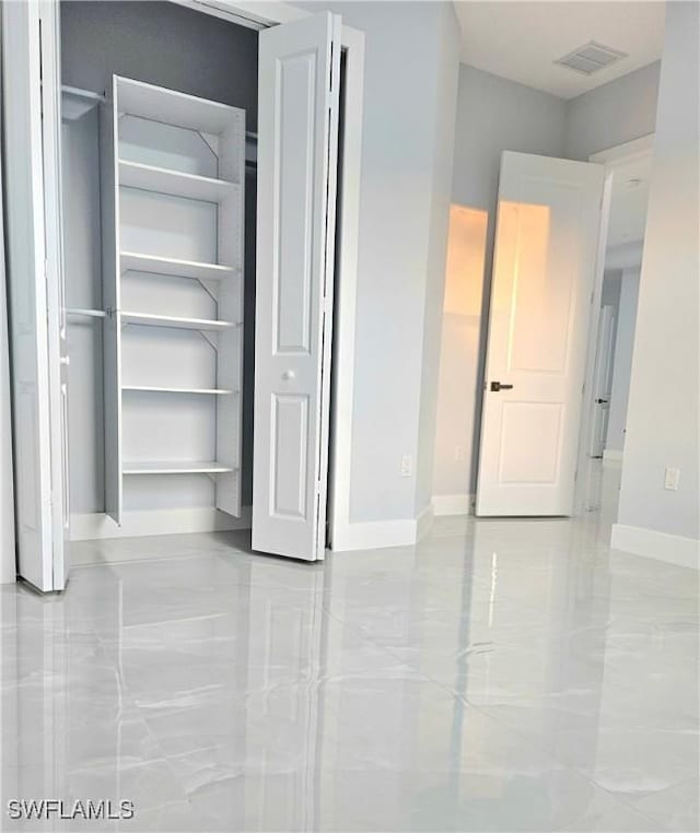 4391 66th Ave NE, Naples, FL 34120 - unfurnished bedroom with baseboards