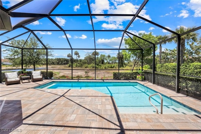8396 Promoso Ct, Naples, FL 34114 - swimming pool featuring a patio area, glass enclosure, and view of wooded area