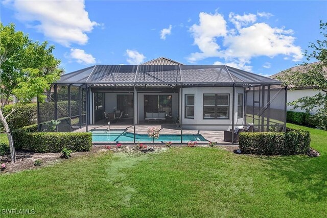 8396 Promoso Ct, Naples, FL 34114 - back of property with a lanai, a yard, a patio area, and stucco siding