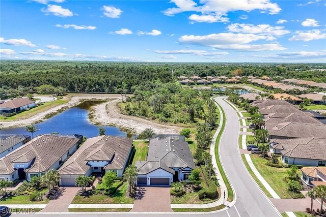 8396 Promoso Ct, Naples, FL 34114 - aerial perspective of suburban area with a forest and a large body of water