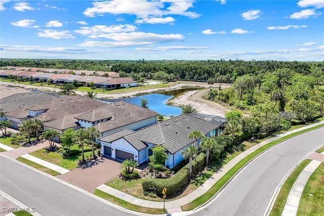 8396 Promoso Ct, Naples, FL 34114 - aerial view of residential area with a large body of water and a forest