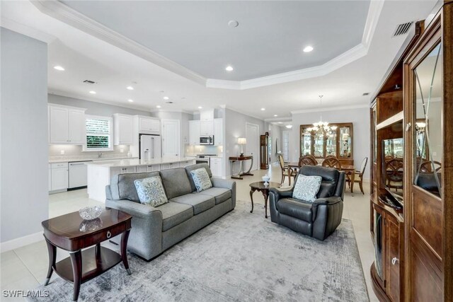 8396 Promoso Ct, Naples, FL 34114 - living area with a chandelier, a raised ceiling, recessed lighting, and crown molding