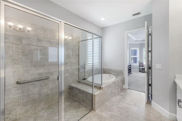 8396 Promoso Ct, Naples, FL 34114 - bathroom featuring a garden tub, tile patterned floors, a shower stall, baseboards, and vanity