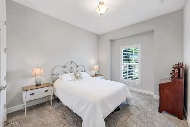 8396 Promoso Ct, Naples, FL 34114 - carpeted bedroom with baseboards