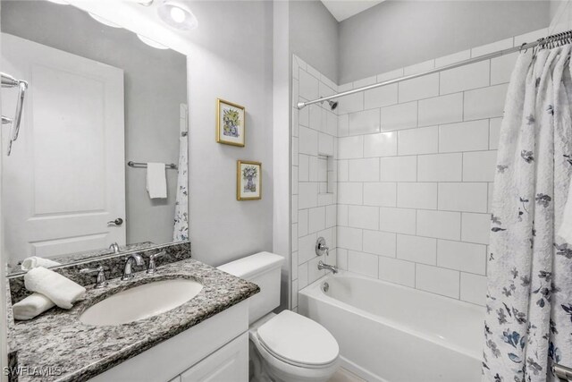 8396 Promoso Ct, Naples, FL 34114 - bathroom featuring toilet, shower / bath combo, and vanity