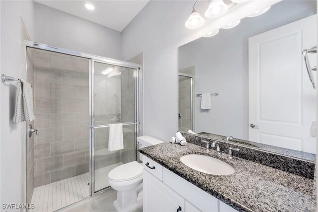 8396 Promoso Ct, Naples, FL 34114 - full bath with a shower stall, toilet, and vanity