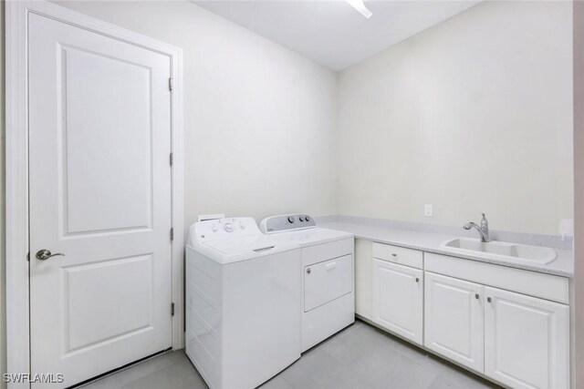 8396 Promoso Ct, Naples, FL 34114 - laundry room featuring washer and dryer, cabinet space, and light tile patterned flooring