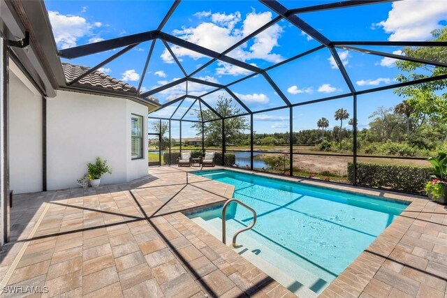8396 Promoso Ct, Naples, FL 34114 - outdoor pool featuring a patio area, a lanai, and a water view