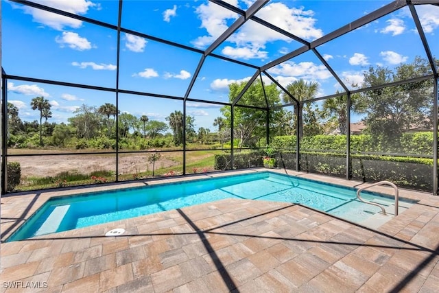 8396 Promoso Ct, Naples, FL 34114 - swimming pool featuring a patio area, glass enclosure, and view of scattered trees