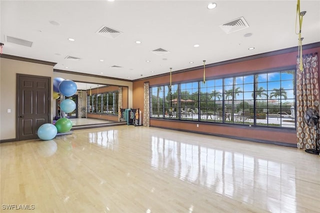 8396 Promoso Ct, Naples, FL 34114 - exercise area featuring crown molding, recessed lighting, and baseboards