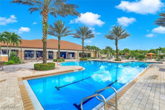 8396 Promoso Ct, Naples, FL 34114 - community pool featuring a patio