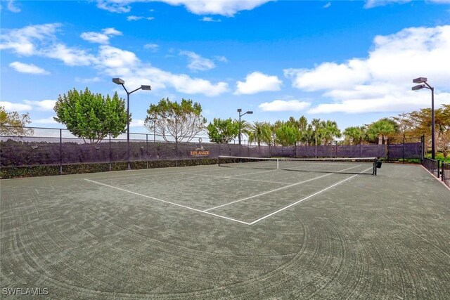 8396 Promoso Ct, Naples, FL 34114 - view of tennis court with community basketball court
