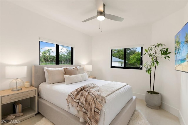 221 10th St SE, Naples, FL 34117 - bedroom featuring multiple windows, ceiling fan, and baseboards