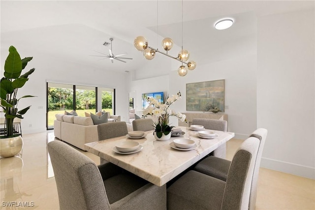 221 10th St SE, Naples, FL 34117 - dining space featuring a chandelier, ceiling fan, and high vaulted ceiling