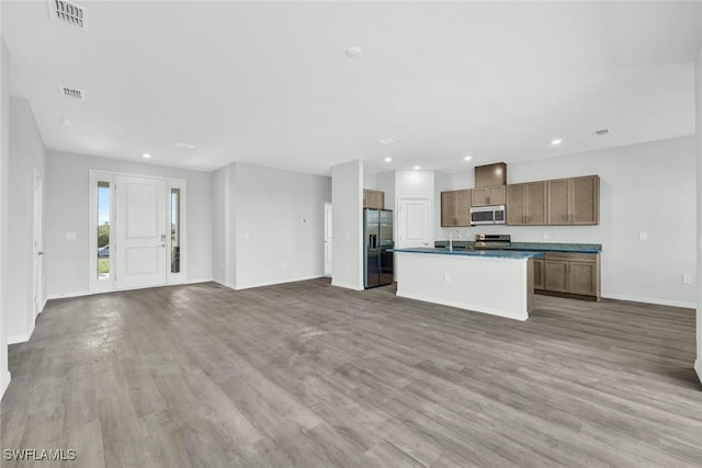 1414 NE 6th Ave, Cape Coral, FL 33909 - kitchen with appliances with stainless steel finishes, open floor plan, a sink, baseboards, and recessed lighting