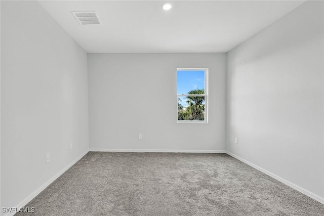 1414 NE 6th Ave, Cape Coral, FL 33909 - carpeted empty room featuring baseboards and recessed lighting