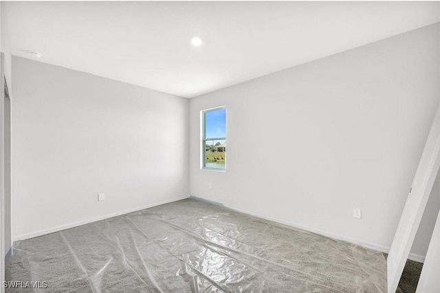 1414 NE 6th Ave, Cape Coral, FL 33909 - carpeted empty room featuring baseboards