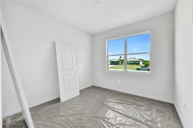 1414 NE 6th Ave, Cape Coral, FL 33909 - spare room with carpet flooring and baseboards
