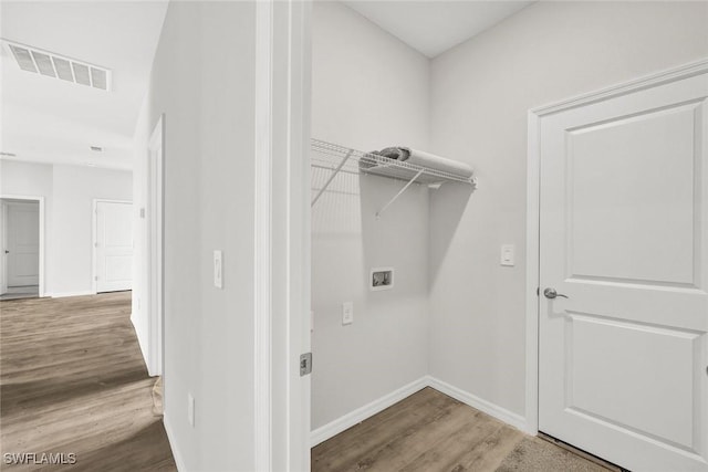 1414 NE 6th Ave, Cape Coral, FL 33909 - laundry area with hookup for a washing machine, wood finished floors, and baseboards