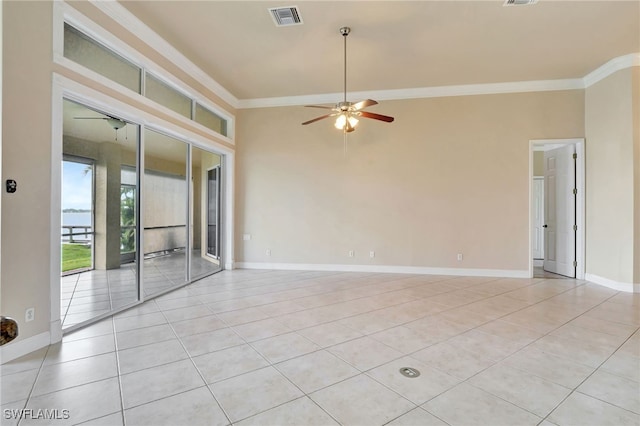 6140 River Shore Ct, North Fort Myers, FL 33917 - spare room with ceiling fan, light tile patterned floors, crown molding, and baseboards