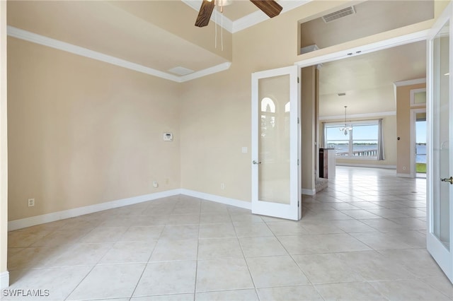 6140 River Shore Ct, North Fort Myers, FL 33917 - spare room with ornamental molding, ceiling fan, light tile patterned flooring, baseboards, and french doors